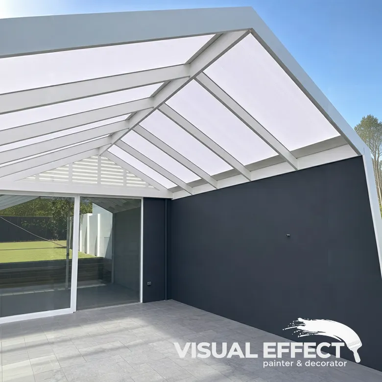 Alfresco area in Perth with a painted patio frame and charcoal feature wall by Visual Effect