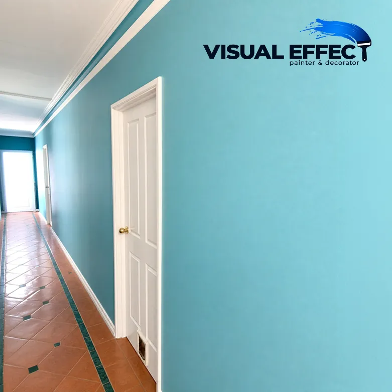 Hallway feature wall painted teal with crisp white doors by Visual Effect in Perth
